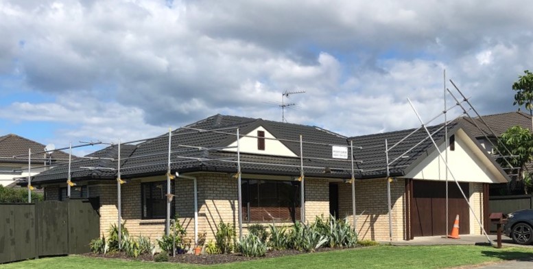 Edge protection scaffolding installed around a residential roof