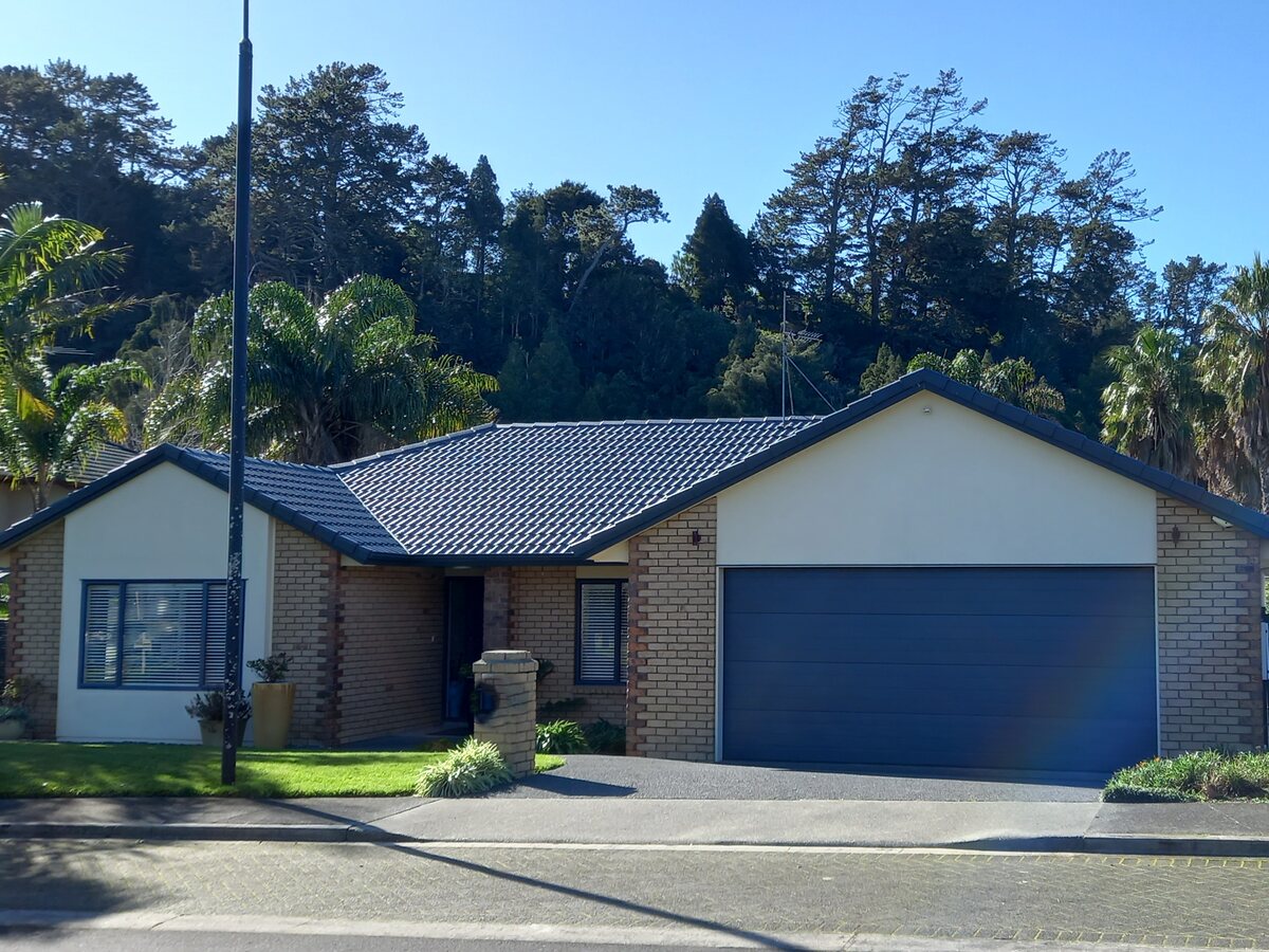 Completed Roofcare concrete tile roof in New Blue on a single storey Auckland home