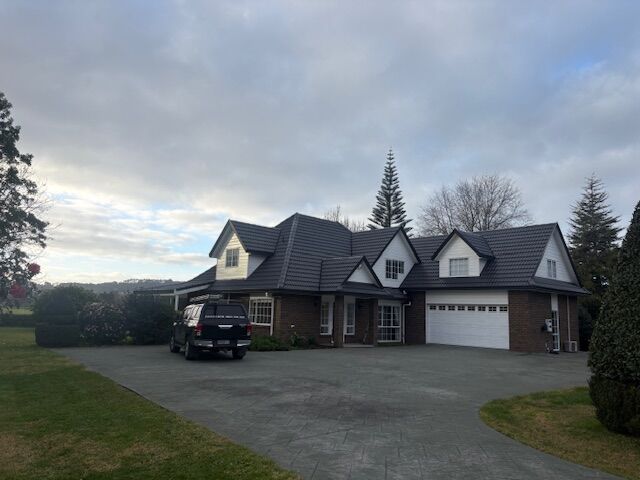 Completed Roofcare roof in Piha Slate on a large Auckland home