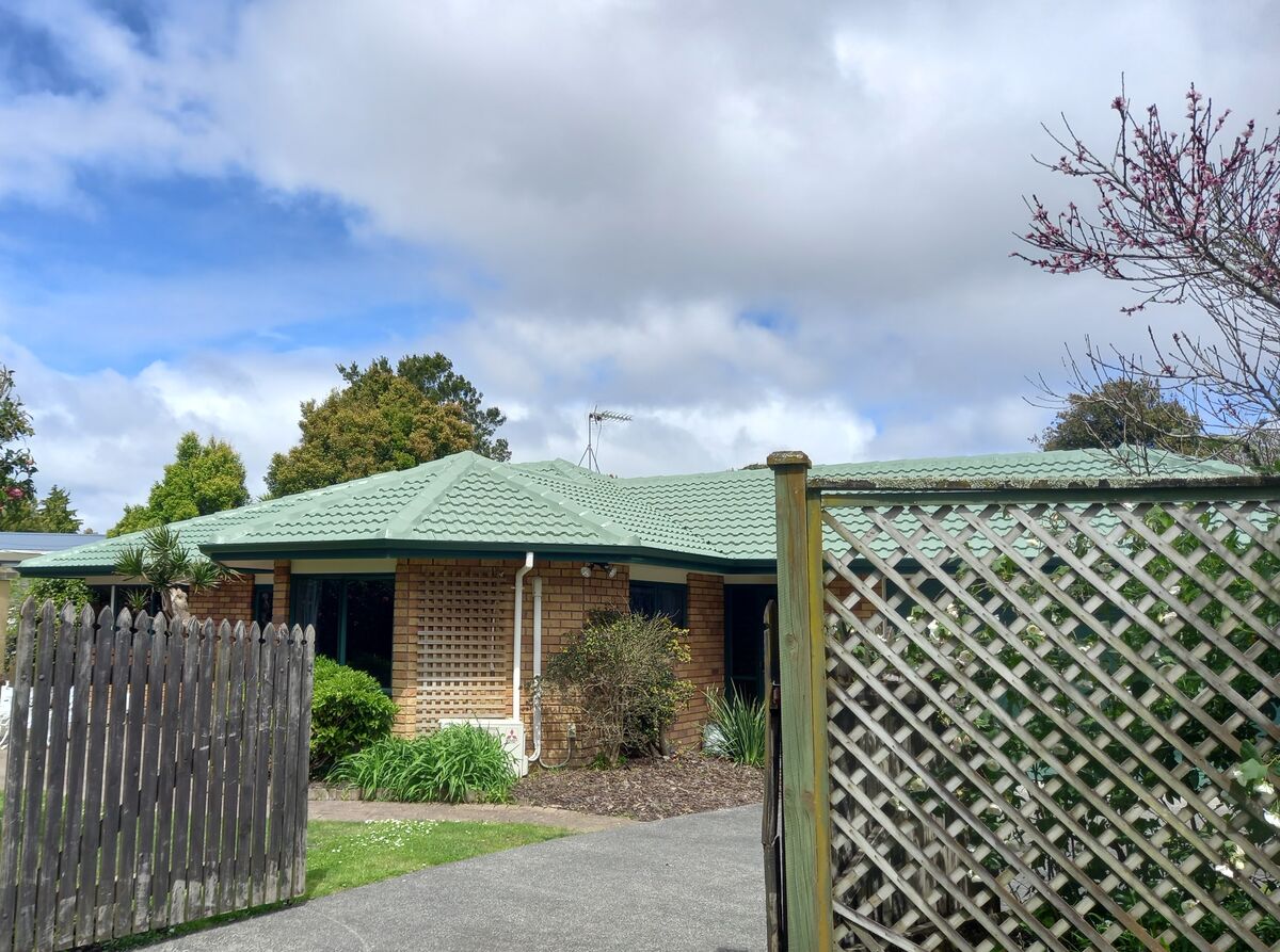 Completed Roofcare roof in Spring Green on a brick Auckland home