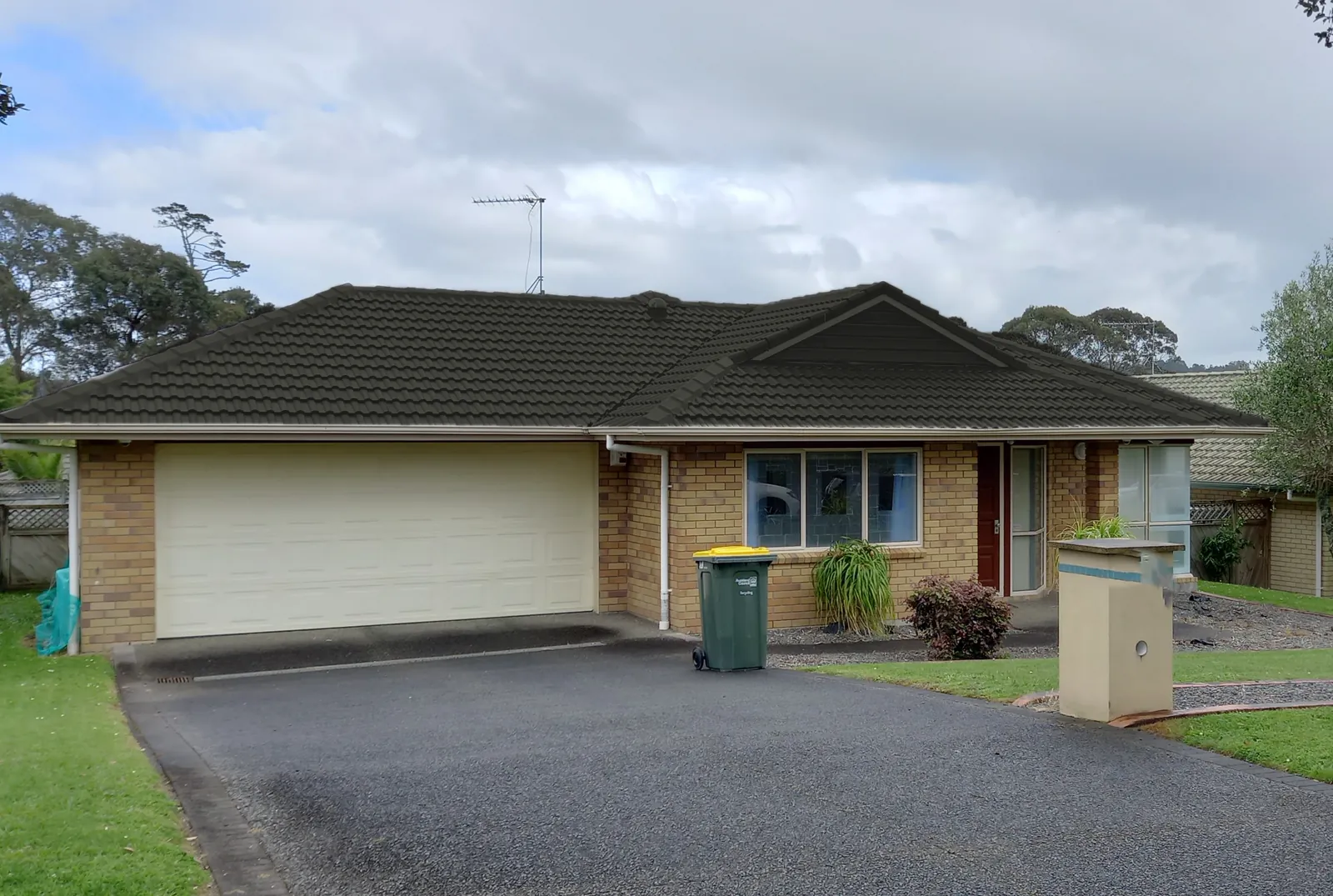 Auckland home with a concrete tile roof shown in Ironsand